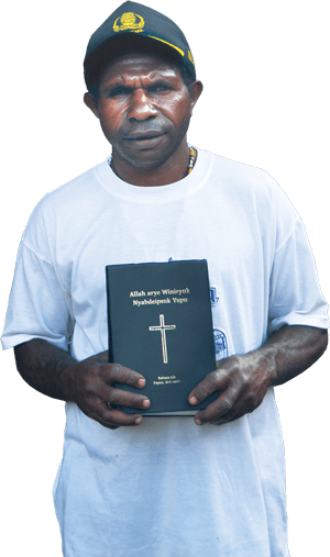 man holding his Bible