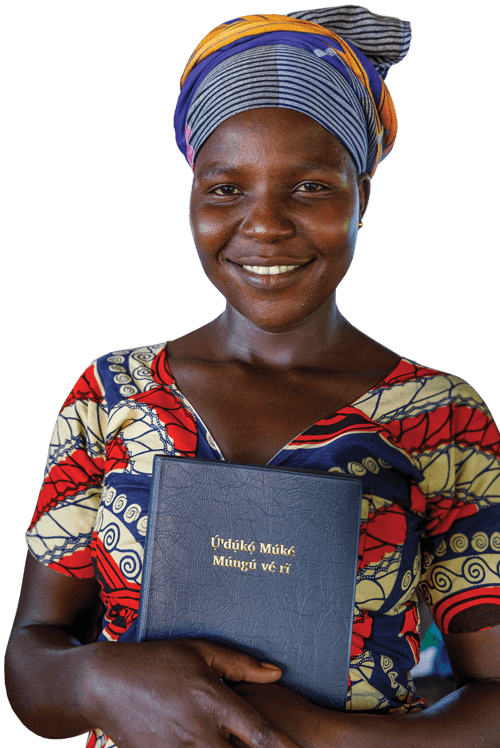 Keliko woman holds her new Bible